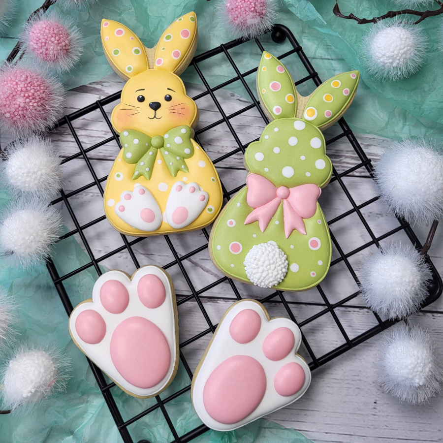 Easter bunny royal icing cookies with pastel decorations and bunny paw cookies