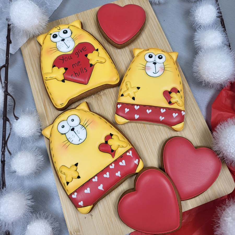 Cute cat Valentine cookies with hearts and love themed decorations