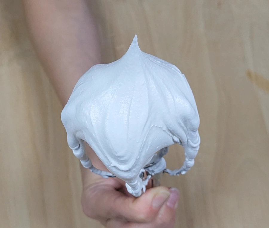 Royal icing forming a stiff peak after whipping